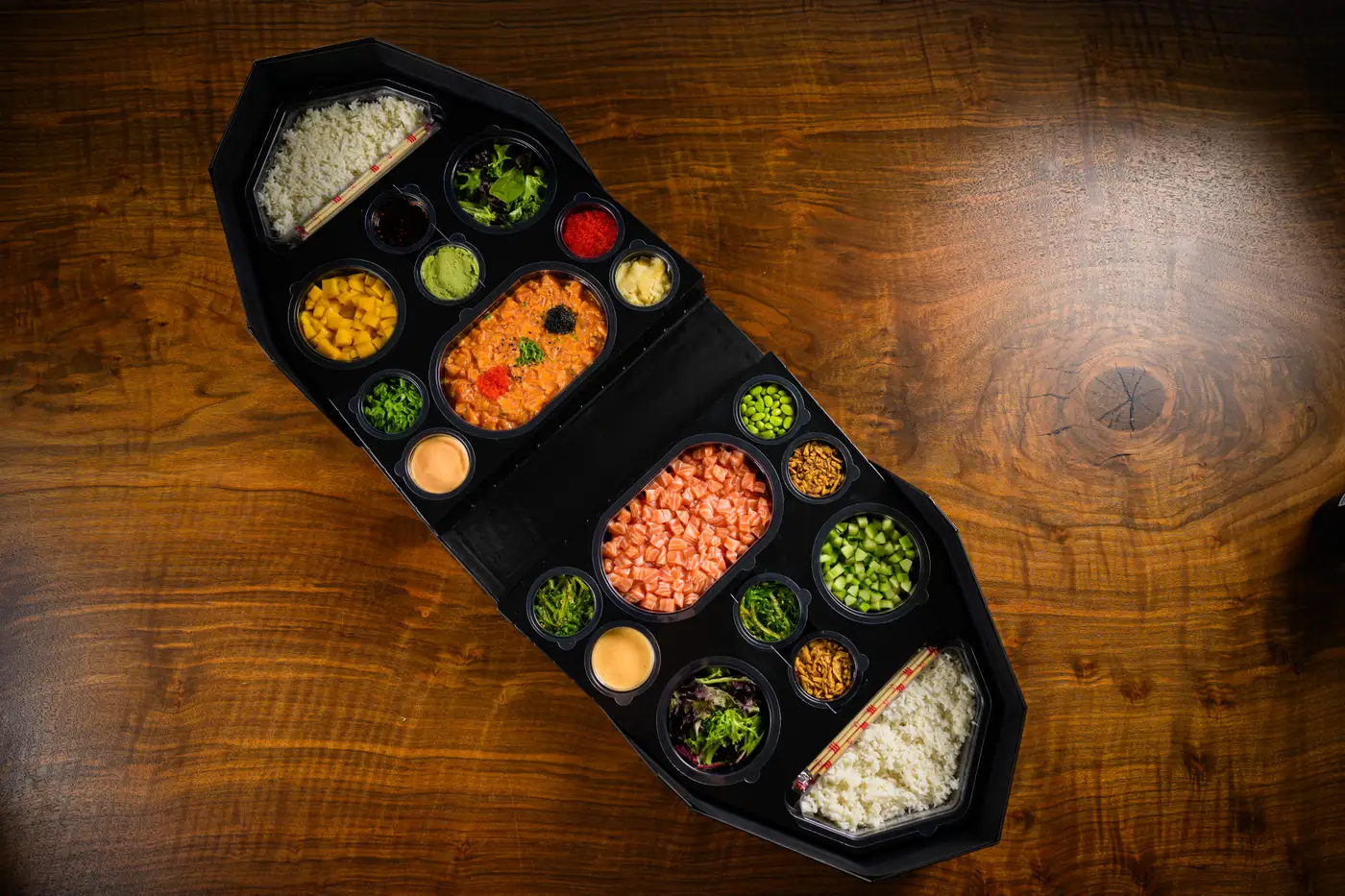 Sushi Boat poke boat from above with moody lighting