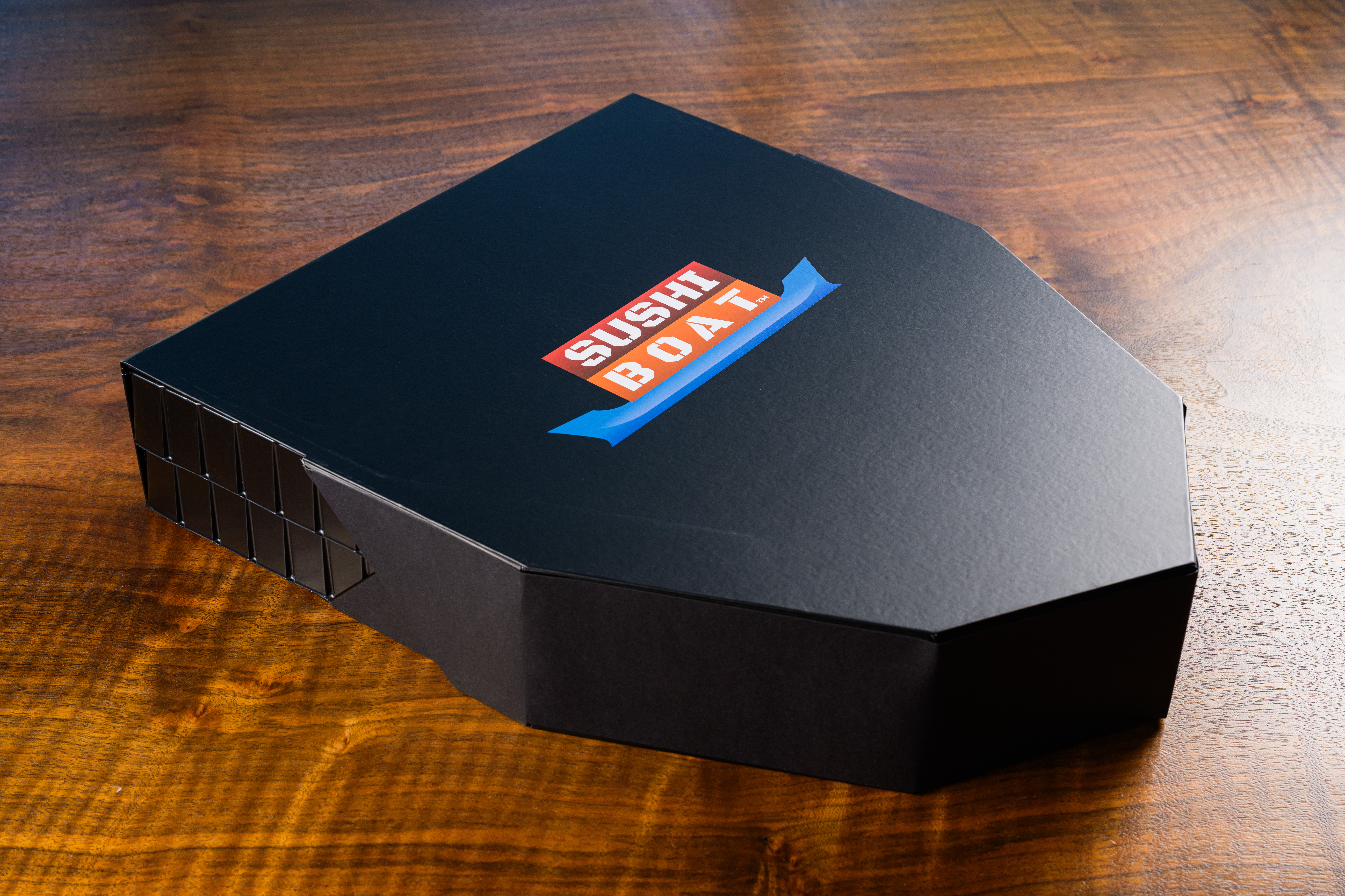 Sushi Boat branded box closed on wooden table