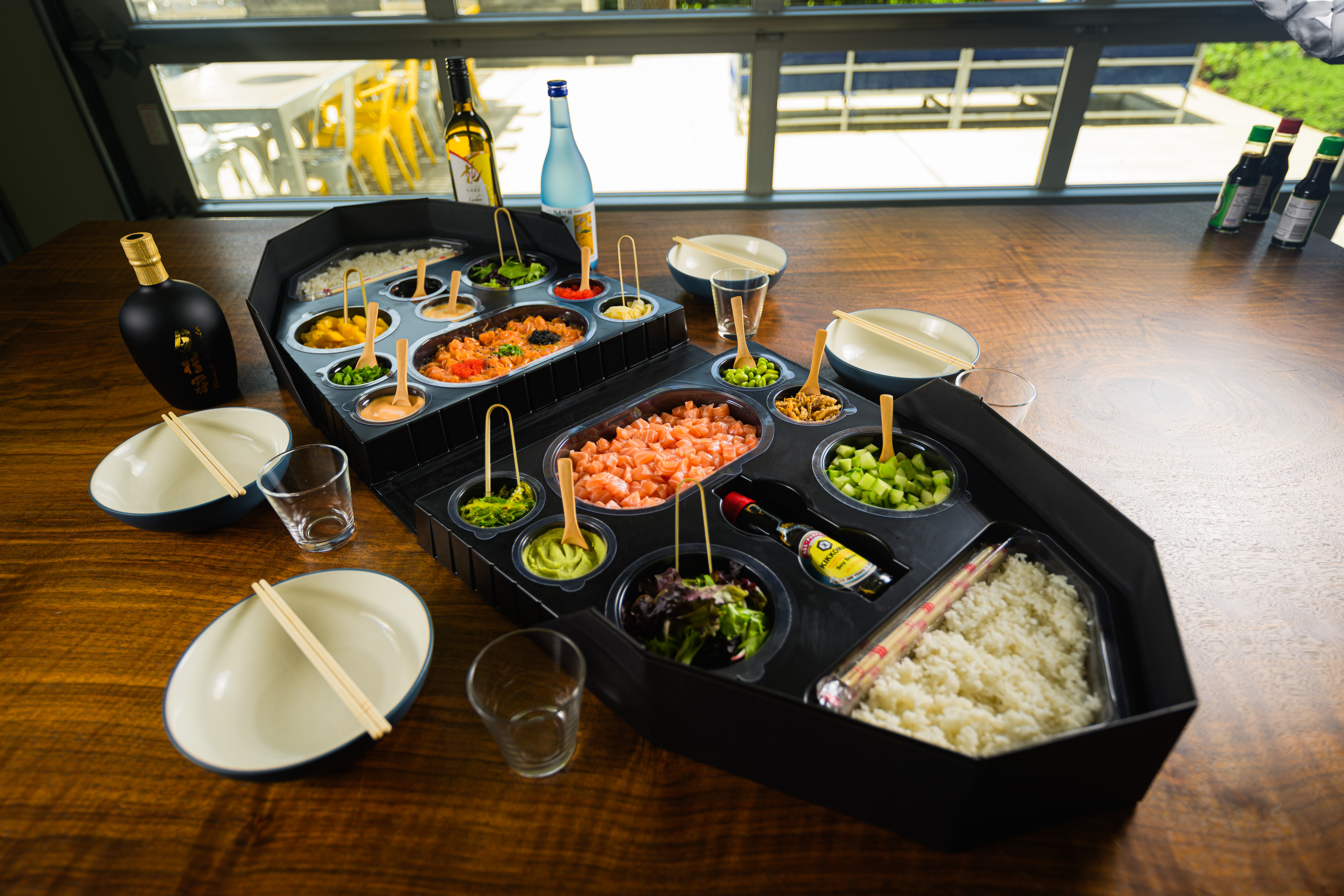 Sushi Boat spread with sake on wooden table